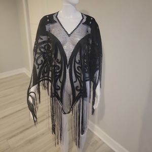 Women  Cover up top with frills. Worn